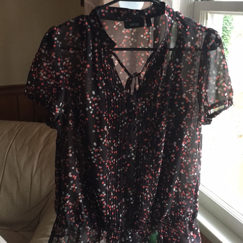 A silk women’s shirt. Only worn 3/4 times.